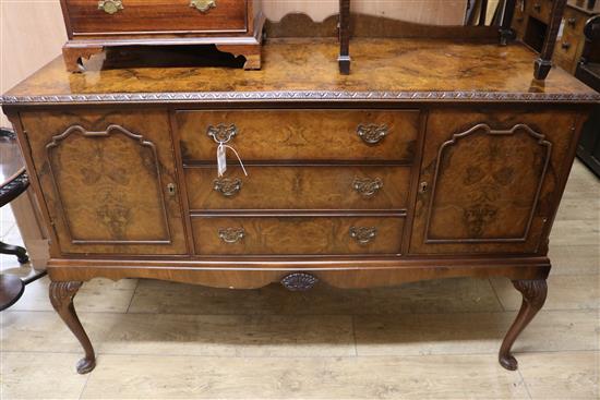 A 1930s walnut sideboard, on cabriole legs W.139cm